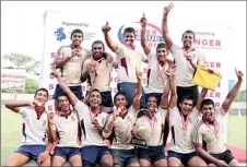  ??  ?? The jubilant winners – Dharmaraja­h rugby outfit celebratin­g