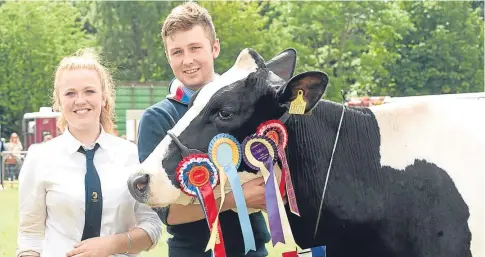  ??  ?? Judy and Kenny Mair Jr with one of their herd after a successful show.