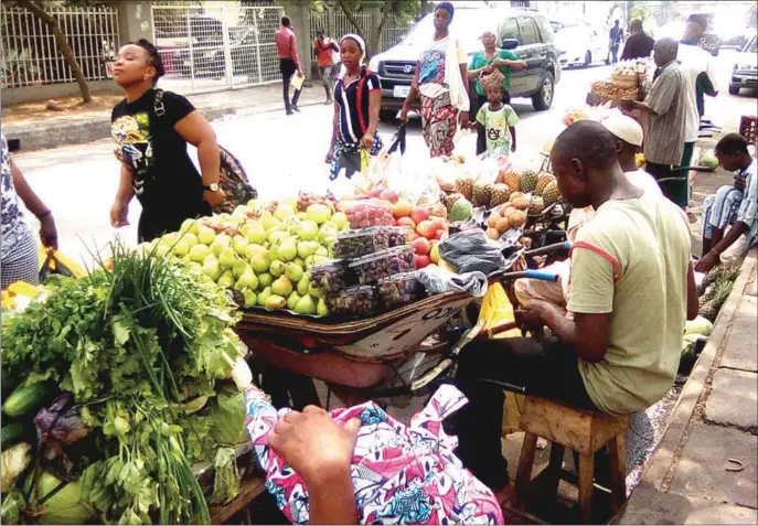  ??  ?? Fruit business in Lagos, as part of a booming agribusine­ss sector