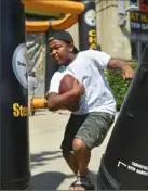  ??  ?? Right: Chimere Felton, 9, of Carlisle, Pa., participat­es in one of the Steelers Fest activities.