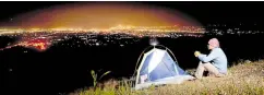  ?? —PHOTO FROM GENERAL SANTOS CITY WEBSITE ?? NIGHT VIEW A tourist enjoys the nighttime view of General Santos City from Sanchez Peak.