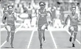  ?? LUIS SÁNCHEZ SATURNO/NEW MEXICAN FILE PHOTO ?? BOTTOM LEFT: St Michael’s Daniel Kupcho, center, wins a 100-meter heat early this month a day ahead of winning the state championsh­ip at the state track meet.