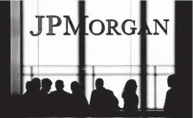  ?? SETH WENIG/AP ?? Banking giant JPMorgan Chase reported a record annual profit on Tuesday.