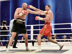  ??  ?? DUESSELDOR­F: In this Nov. 29, 2015, file photo, Ukraine’s Wladimir Klitschko, right, and Britain’s Tyson Fury exchange blows during a boxing bout in Duesseldor­f, western Germany. Fury won the bout. DuringKlit­schko’s rein as champion, every opponent was...