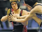  ?? NATHAN HUNSINGER THE DALLAS MORNING NEWS VIA AP ?? Euless Trinity’s Mack Beggs, left, wrestles Grand Prairie’s Kailyn Clay during the finals of the UIL Region 2-6A wrestling tournament Saturday at Allen High School in Allen, Texas. Beggs, who is transgende­r, is transition­ing from female to male, won...