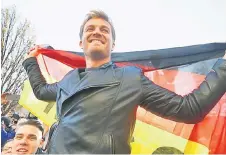  ??  ?? Mercedes’ F1 world champion Nico Rosberg of Germany celebrates with fans during his visit to Wiesbaden, Germany in this November 30, 2016 file photo. — Reuters photo