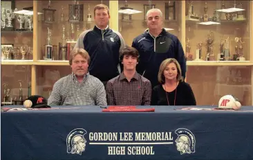  ??  ?? Parents Chris and Karen Clark, along with Gordon Lee head coach Mike Dunfee and assistant coach Derek McDaniel were among those on hand last Wednesday afternoon as senior pitcher Ethan Clark signed his letter of intent to play baseball at Austin Peay....