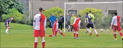  ??  ?? Scott Maitland, far left, looks on as he sees his header hit the back of the net to put his team 2- 0 in front.