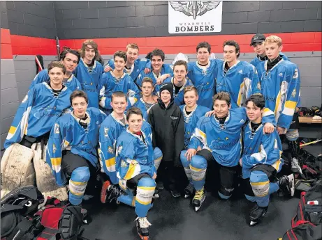  ??  ?? Oliver Smith, posing with the members of the Wearwell Bombers bantam team. Oliver, who is battle cancer, got his wish granted, and dropped the puck at their game against the Bedford Barons, on Saturday night.