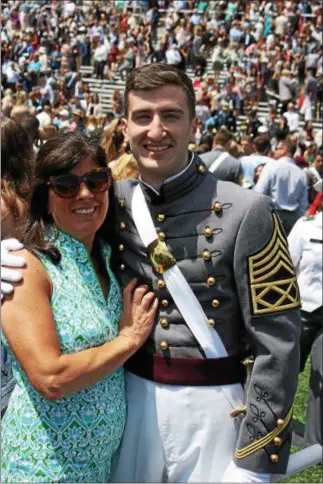  ?? PHOTO PROVIDED ?? Gerald Fitzhugh McDonough, a 2013 La Salle Institute graduate, stands with his mother, Florence McDonough, during his commenceme­nt last weekend at the U.S. Military Academy in West Point.