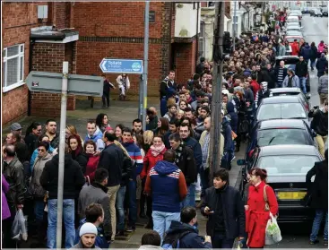  ??  ?? Queue here: Romanians wait in Portsmouth to vote in their country’s elections last year