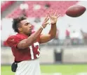  ?? MICHAEL CHOW/THE REPUBLIC ?? Cardinals receiver Christian Kirk (13) catches a ball during camp at University of Phoenix Stadium on Wednesday.