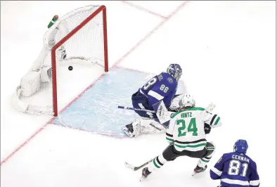  ?? Bruce Bennett / TNS ?? The Dallas Stars’ Roope Hintz (24) watches a goal by teammate Joel Kiviranta, not pictured, go past Tampa Bay Lightning goaltender Andrei Vasilevski­y (88) during the second period in Game 1 of the Stanley Cup Final at Rogers Place in Edmonton, Canada, on Saturday. The Stars won, 4-1.