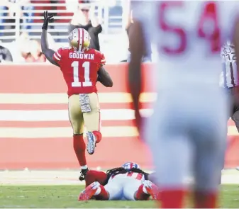  ?? Thearon W. Henderson / Getty Images ?? Receiver Marquise Goodwin’s speed left the Giants’ Janoris Jenkins floored — or perhaps, more correctly, grounded — on an 83-yard touchdown catch midway through the second quarter.