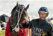  ?? PHOTO: JOSEPH JOHNSON/STUFF ?? Lazarus with trainer-driver Mark Purdon.