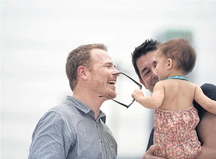  ??  ?? GLASSES HALF FULL: Gordon Lake, left, and Manuel Valero have managed to stay positive. They have been trapped in Thailand during their 14-month battle to secure custody of their daughter, Carmen.