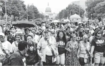  ?? H. DARR BEISER, USA TODAY ?? A crowd marches on Pennsylvan­ia Avenue near the Capitol in Washington on Wednesday. Many groups made pleas for improved civil rights, clean air and water, an end to homelessne­ss and more.