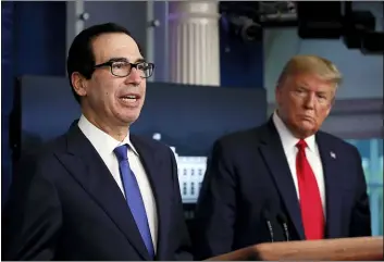  ?? ALEX BRANDON — THE ASSOCIATED PRESS FILE ?? In this April 13, 2020, file photo President Donald Trump listens as Treasury Secretary Steven Mnuchin speaks about the coronaviru­s in the James Brady Press Briefing Room at the White House in Washington. The Trump administra­tion and Congress are nearing an agreement as early as Sunday, April 19, on a $400-plus billion aid package to boost a small-business loan program that has run out of money and add funds for hospitals and COVID-19 testing.