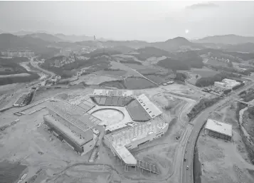  ?? ED JONES, AFP/ GETTY IMAGES ?? Constructi­on of Pyeongchan­g Olympic Stadium, site of the opening and closing ceremonies, is proceeding according to schedule, organizers say.