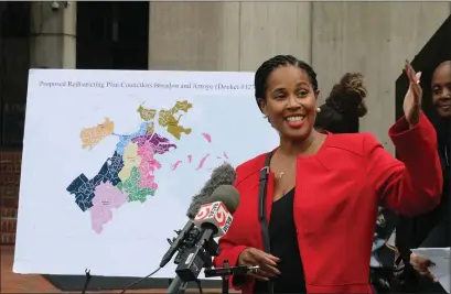  ?? NANCY LANE — BOSTON HERALD ?? Tanisha Sullivan, president NAACP Boston with the proposed redistrict­ing, or “unity” map of the city last fall. The map has sparked outrage and a lawsuit.