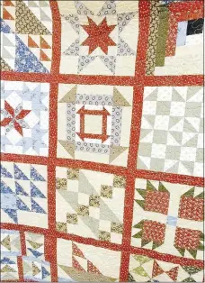  ?? Lynn Atkins/The Weekly Vista ?? Some people believe that each of the patterns on this modern quilt contains informatio­n that could be used by fugitive slaves during the Civil War.