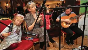  ?? Photo by Valerie O’Sullivan ?? Renowned singer and musician Muireann Nic Amhlaoibh, Dun Chaoin, West Kerry, performing live with her daughter, Laoise; and guitarist Matt Griffin.