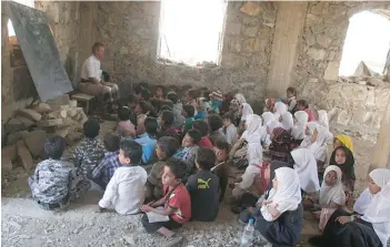 ?? — Reuters ?? Yemeni students attend a class at an unfinished school building in the southweste­rn city of Taiz on Sunday.