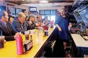  ?? [PHOTO BY DOUG HOKE, THE OKLAHOMAN ARCHIVES] ?? Justin “Nic” Nicholas, seen here at right in 2015, is now taking orders for dinner on Friday nights at Nic’s Grill.