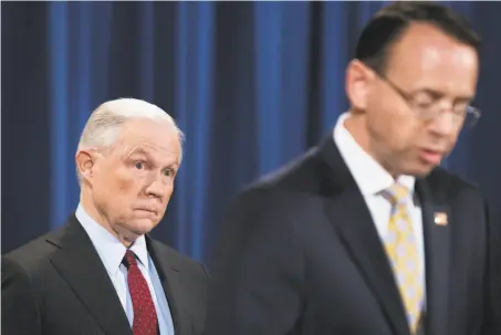  ?? Tom Brenner / New York Times ?? Attorney General Jeff Sessions, with Deputy Attorney General Rod Rosenstein, seeks to pull big grants from sanctuary cities.