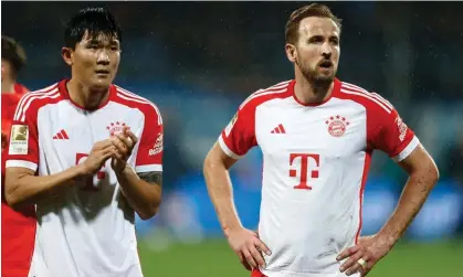  ?? ?? Harry Kane, who scored late on but missed a good chance, is dejected at the final whistle. Photograph: Leon Kuegeler/Reuters