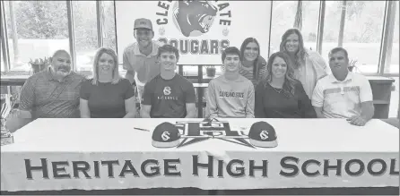  ?? Scott Herpst ?? Brian, Kari and Eli Owens, along with Jason, Kristie, Kassidie and Reagan Armour, were among the many on hand to watch Heritage baseball seniors Max Owens and J.C. Armour sign on to continue their playing careers at Cleveland State last week.