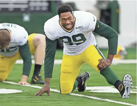  ?? JIM MATTHEWS / USA TODAY NETWORK-WISCONSIN ?? Green Bay Packers tight end Jared Cook smiles while stretching before practice on Thursday afternoon inside the Don Hutson Center.