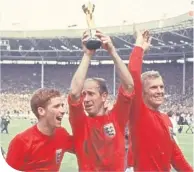  ??  ?? Sir Bobby Charlton alongside England’s greatest-ever skipper in Bobby Moore and Alan Ball at Wembley in 1966