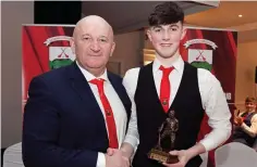  ??  ?? Eamonn Esmond presents the Junior Player of the Year award to Gary Hughes.