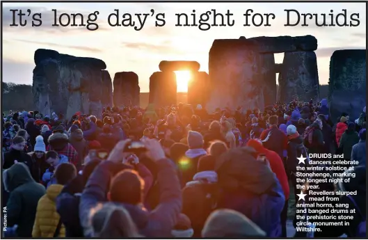  ??  ?? ★
DRUIDS and dancers celebrate the winter solstice at Stonehenge, marking the longest night of the year.
★
Revellers slurped mead from animal horns, sang and banged drums at the prehistori­c stone circle monument in Wiltshire.