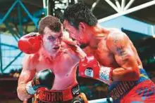  ?? AFP ?? Australian Jeff Horn (left) and Manny Pacquiao during their bout in Brisbane. Horn scored a shock welterweig­ht title victory over Pacquiao.